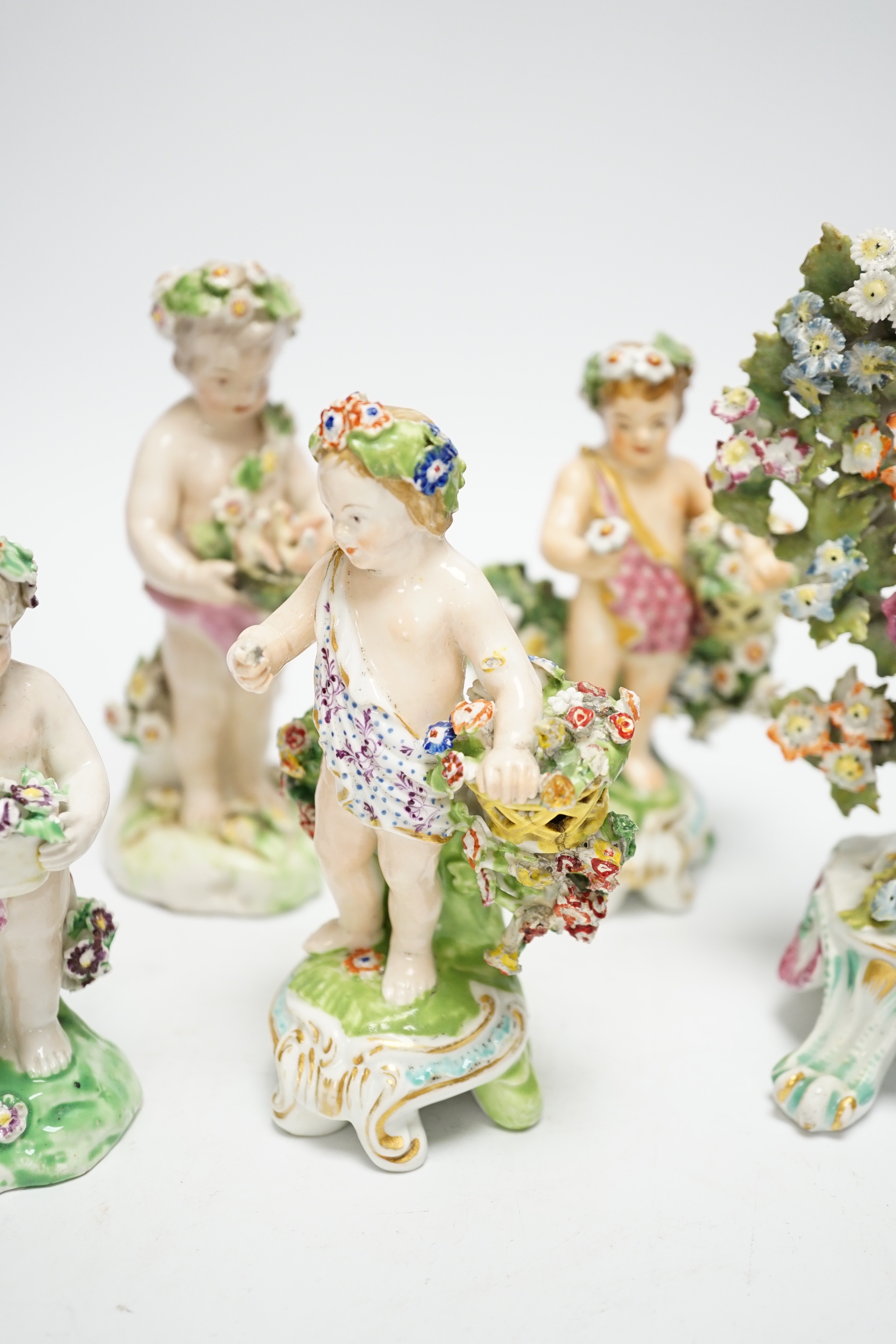 Six 18th/19th century figures by Bow and Derby, including a flower encrusted Bow figure with bocage, 15cm